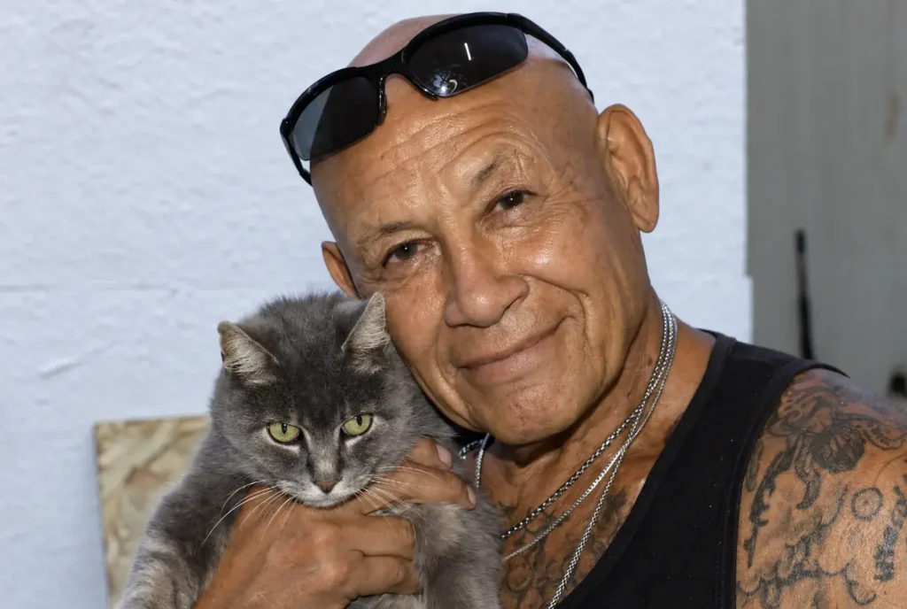 Man holding MuMu the cat